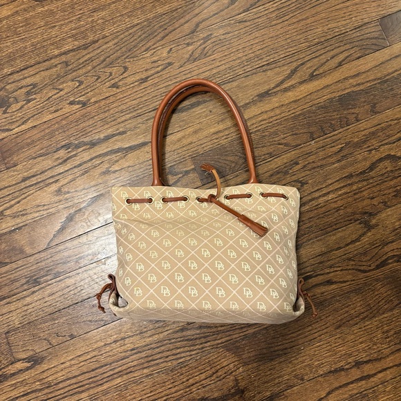 Dooney & Bourke Handbags - Dooney and Bourke Tan DB Monogram Magnetic Closure Leather Handle Bag Tassels